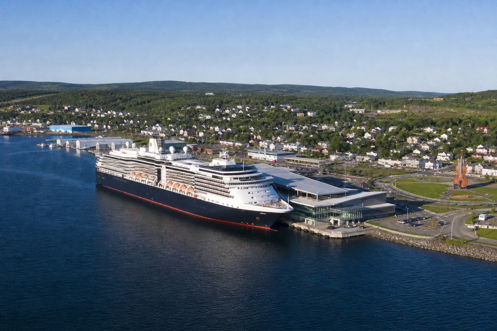 Cruise ship at the Port of Sydney, Nova Scotia with the Joan Harriss Cruise Pavilion on Cape Breton Island